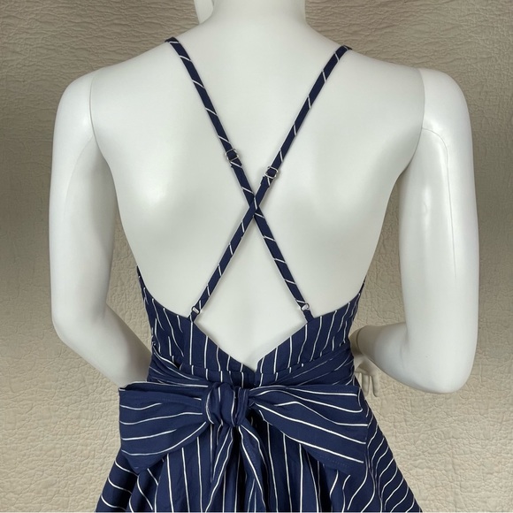 🔥Lulus Ruffle & Flow Black Striped Backless Ruffle
Romper Blue White - Picture 9 of 16